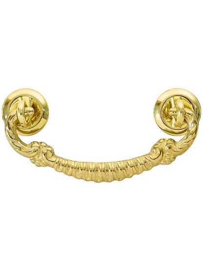 Ornate Brass Bail Pull with Round Rosettes - 3 inch Center-to-Center in Unlacquered Brass Finish.